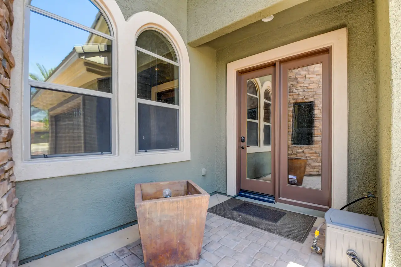 Separate double-door entrance to the flex room from a side patio